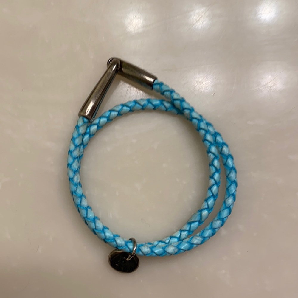 Blue leather wrap-around bracelet with sterling silver tag and clasps
